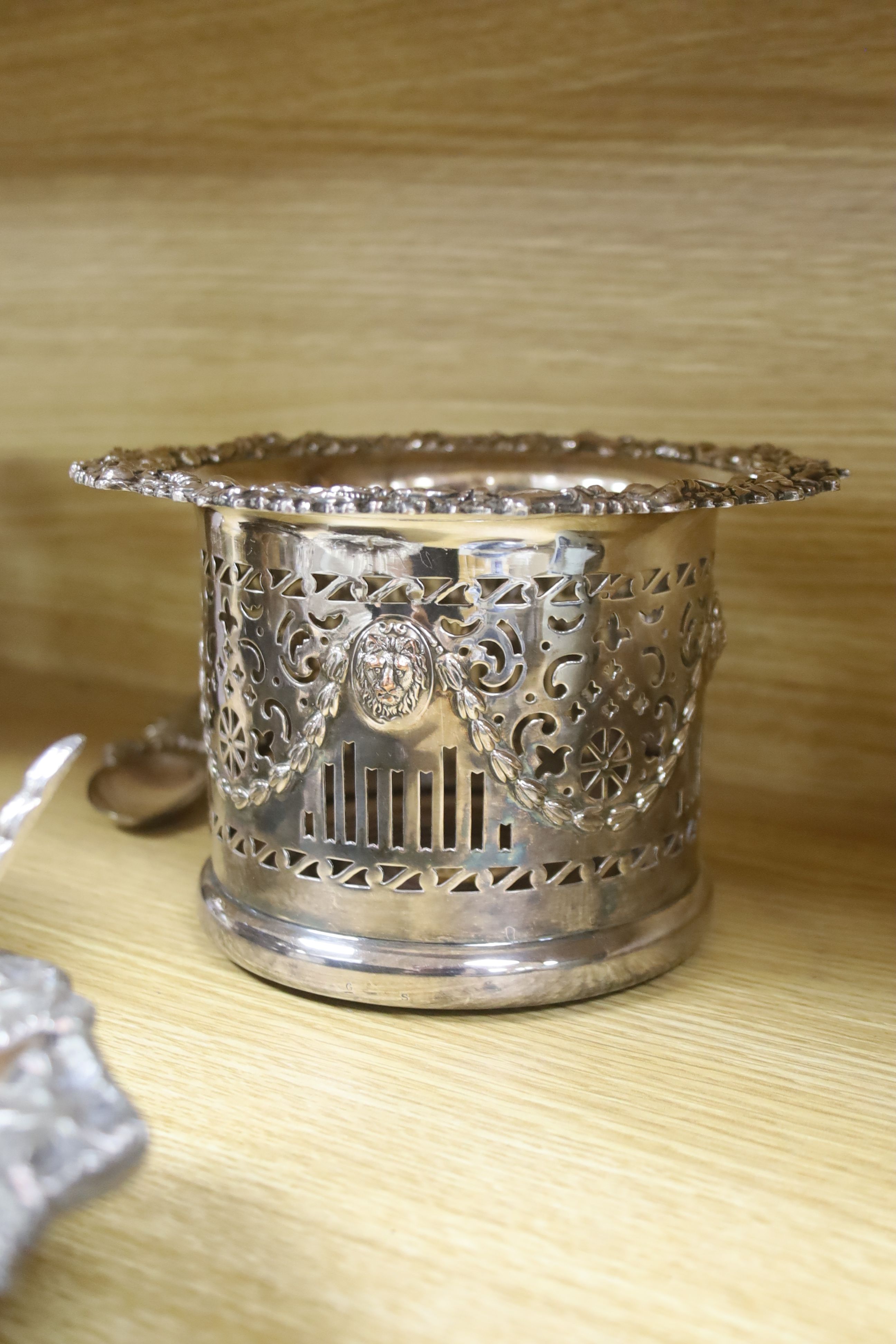 A pair of late Victorian pierced silver plated magnum coasters, height 12cm, two other pairs of plated wine coasters, one other and two spoons.